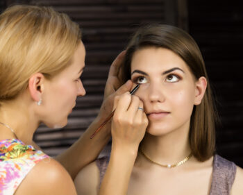 Woman applying eyeliner